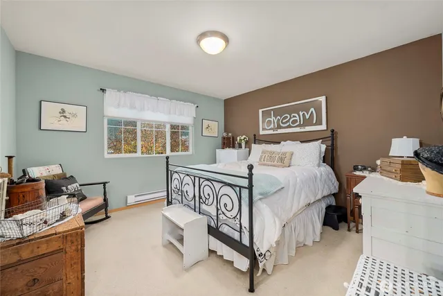 a bedroom with a bed and a table in it