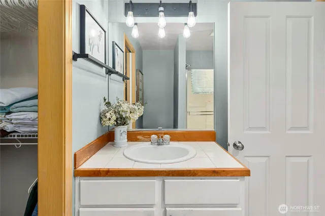 a bathroom with a sink and a mirror