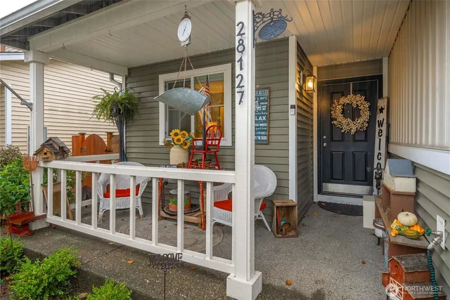 a view of a balcony with chairs