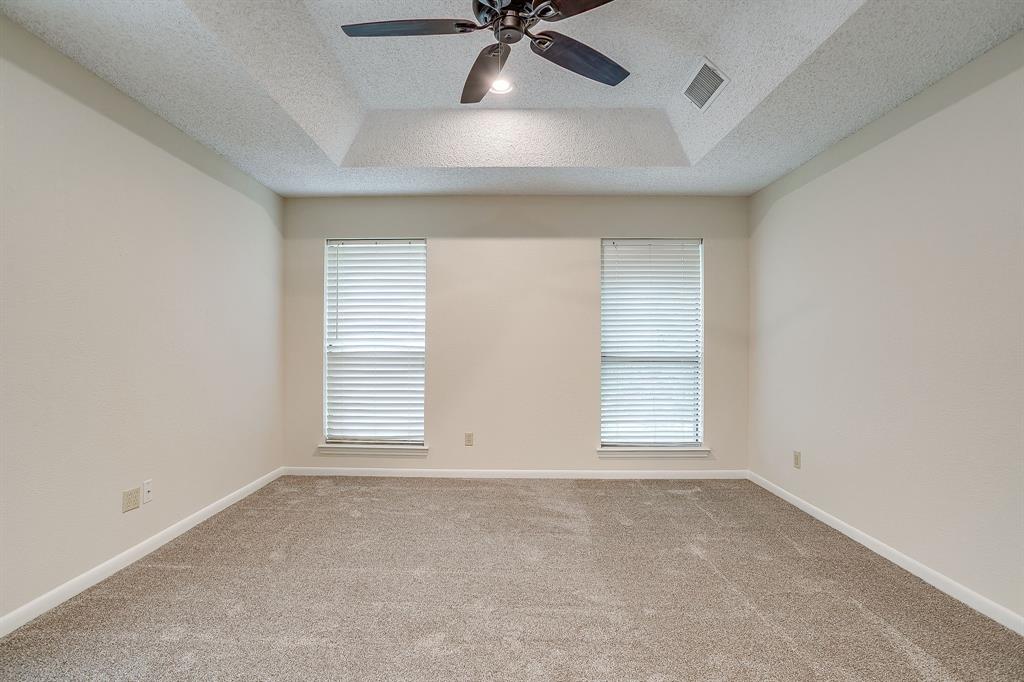 8613 Silver Creek Road White Settlement, TX 76108 - Photo 37 of 40 an empty room with a ceiling fan and window