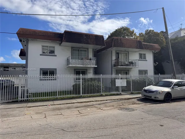 a view of a car park in front of house