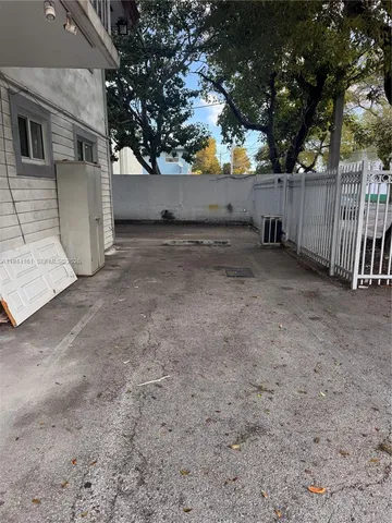 a view of backyard and tree