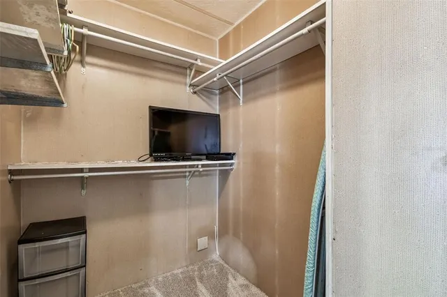 a front view of a house with a garden and plants