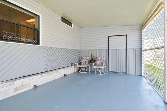 an aerial view of residential houses with outdoor space and swimming pool