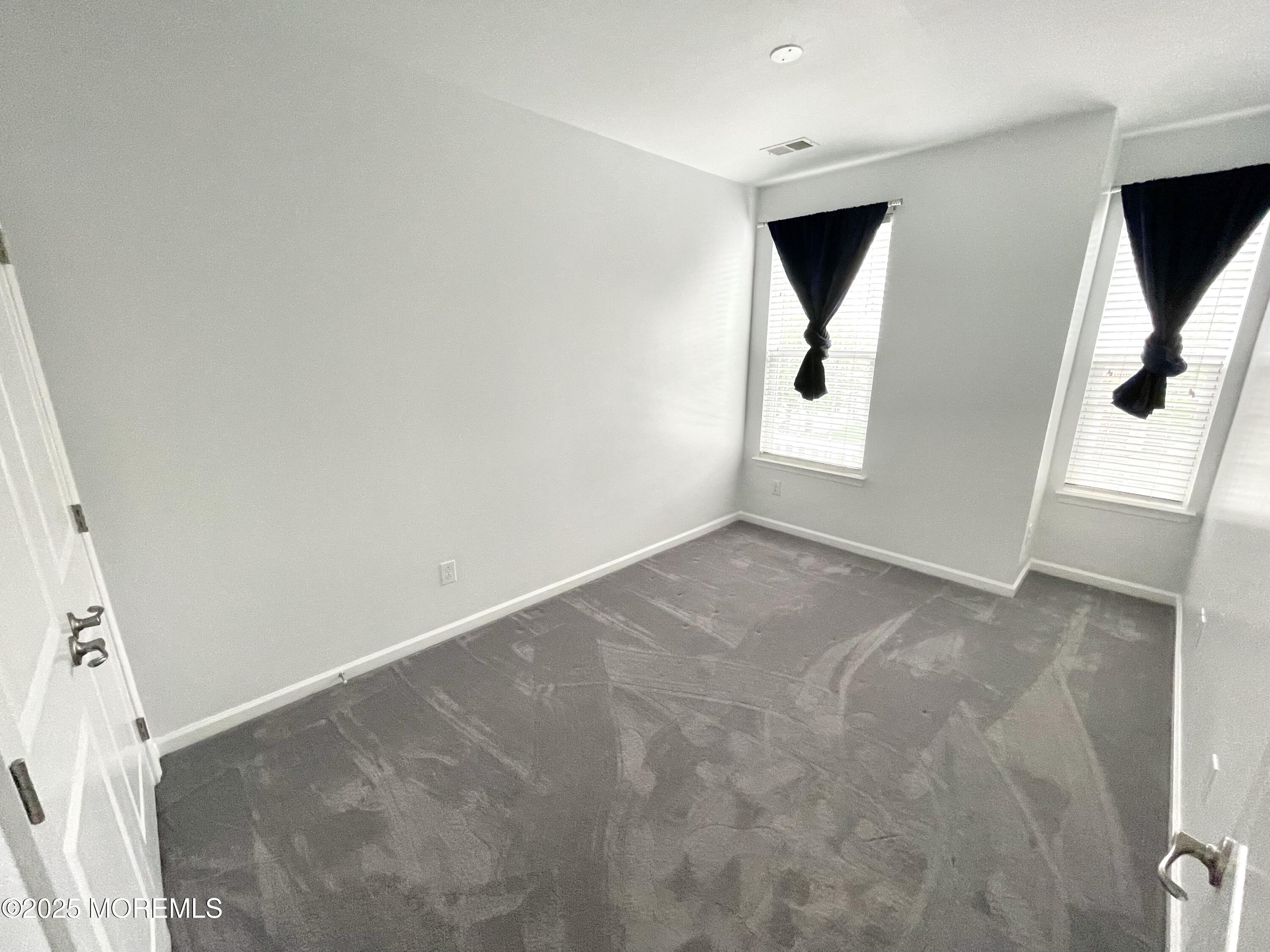 46 Michael Drive Tinton Falls, NJ 07712 - Photo 14 of 16 an empty room with windows