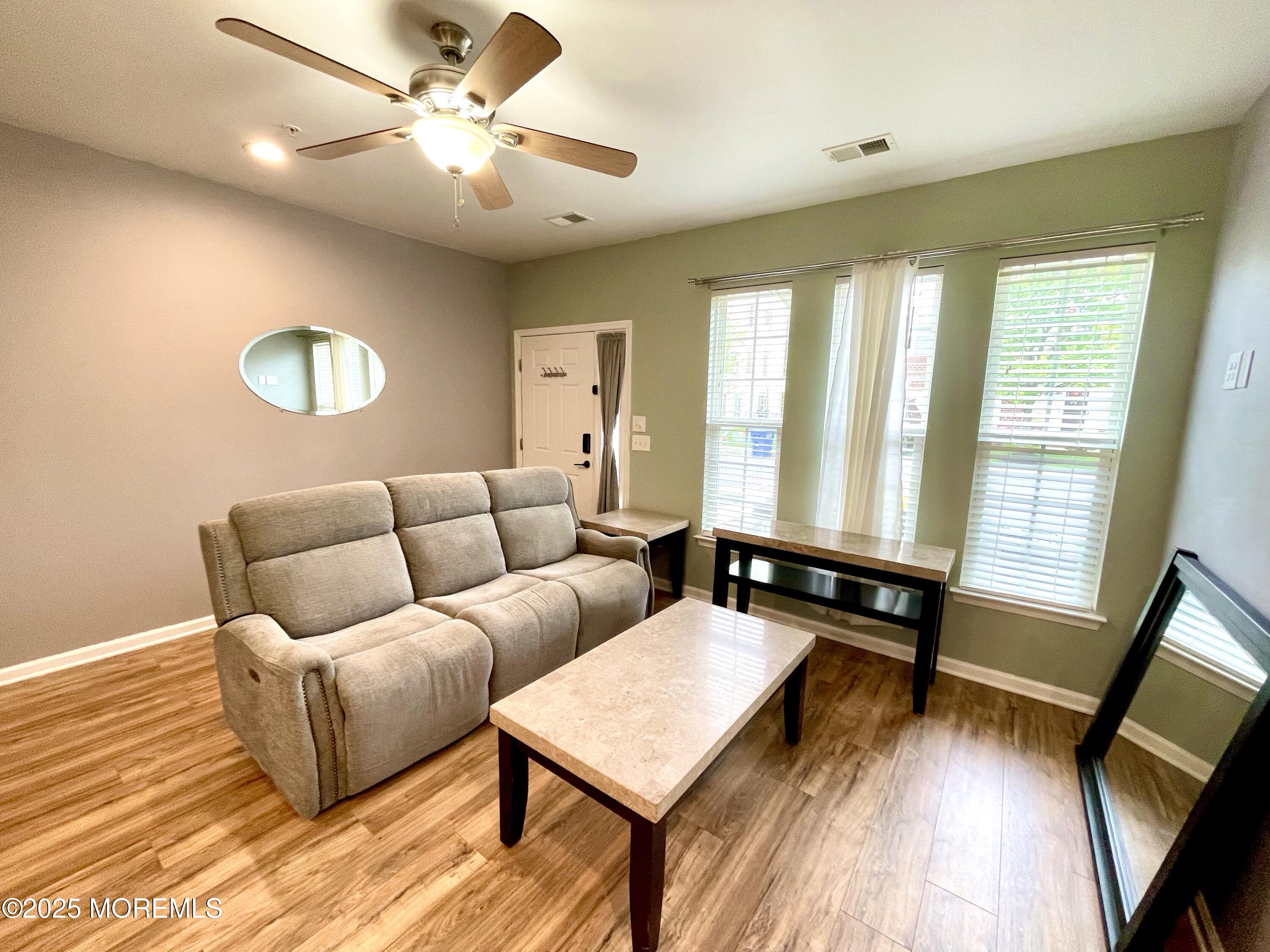 46 Michael Drive Tinton Falls, NJ 07712 - Photo 5 of 16 a living room with furniture and a window