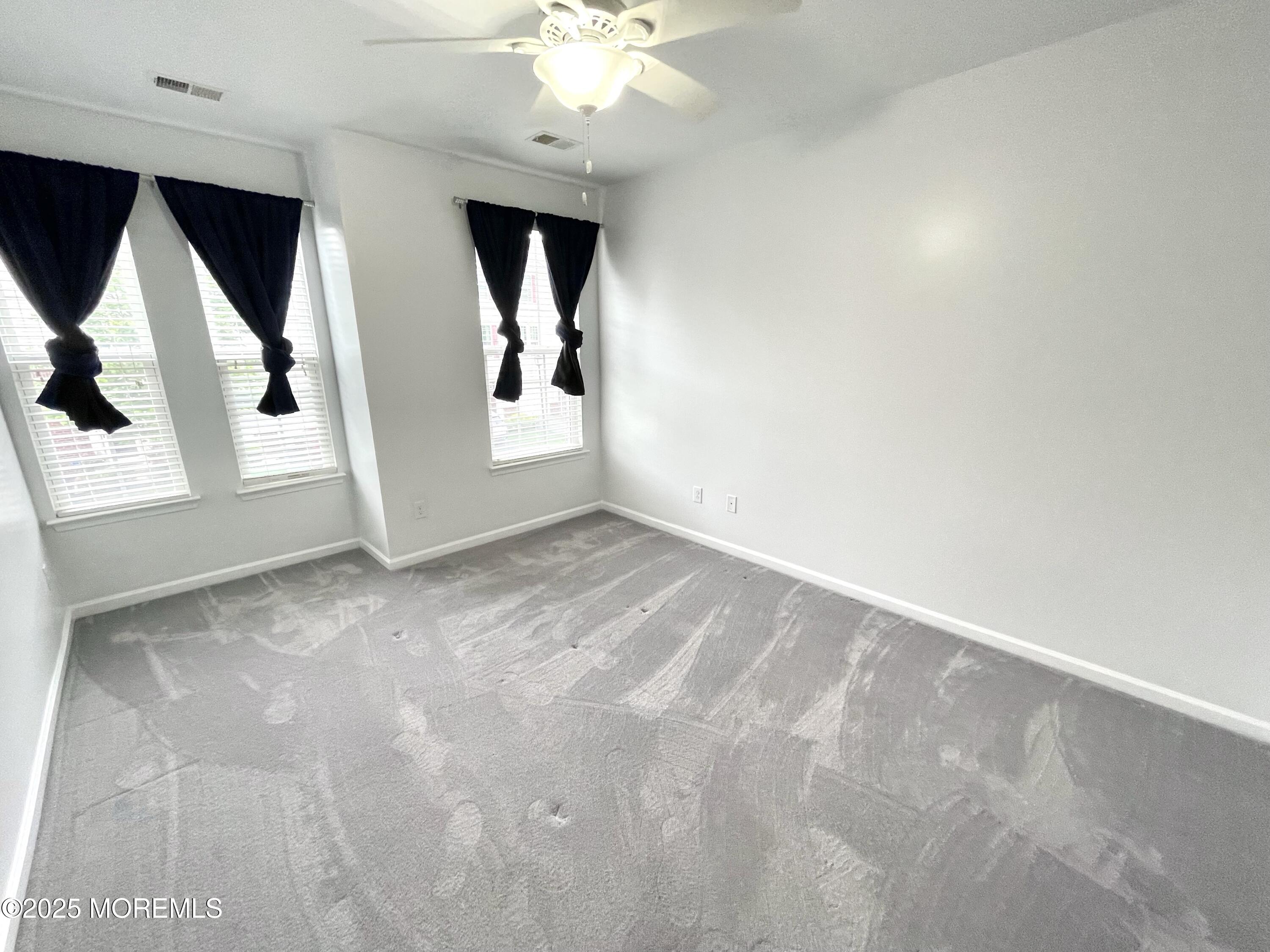 46 Michael Drive Tinton Falls, NJ 07712 - Photo 9 of 16 wooden floor in an empty room