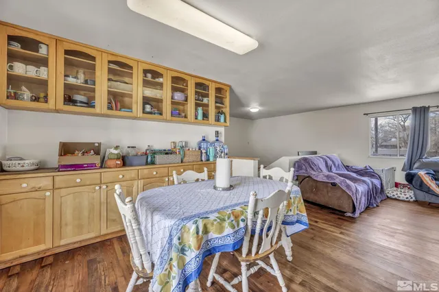 a spacious bedroom with a bed and a table in it