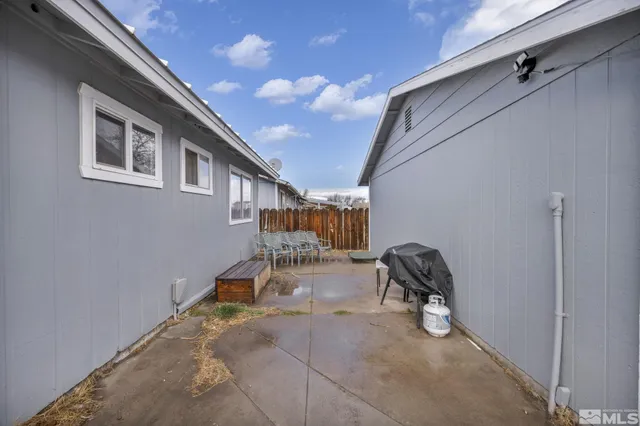 a room with gym equipment and a rug