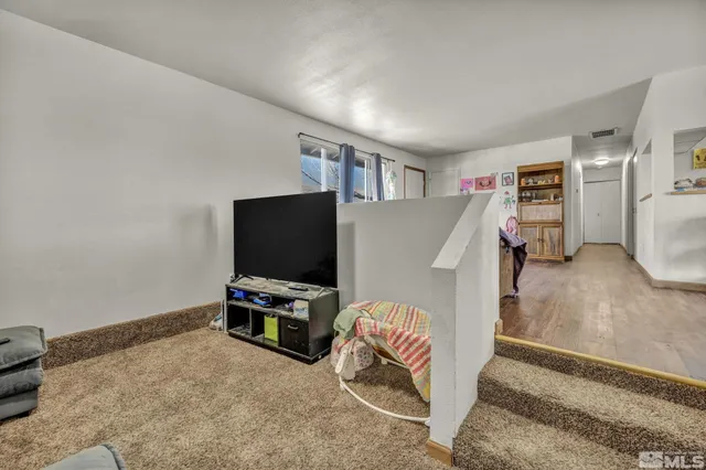 a room with furniture and a flat screen tv