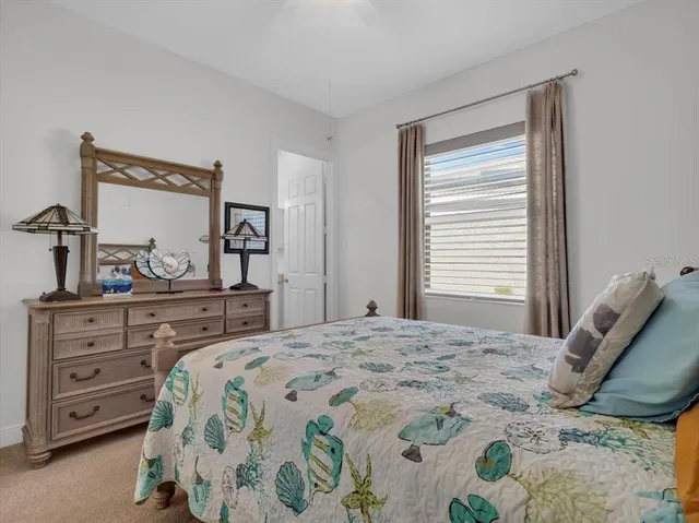 a kitchen with kitchen island a counter top space cabinets and stainless steel appliances