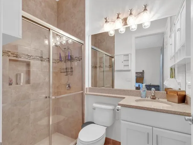 an aerial view of house with a swimming pool outdoor seating and yard