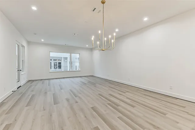 a bathroom with a toilet a sink a mirror and vanity