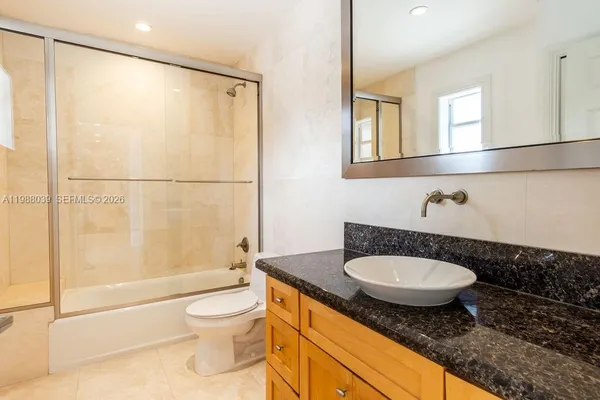 an empty room with a empty space and windows