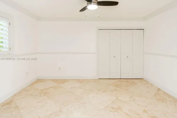 a bathroom with a granite countertop shower a mirror and a sink