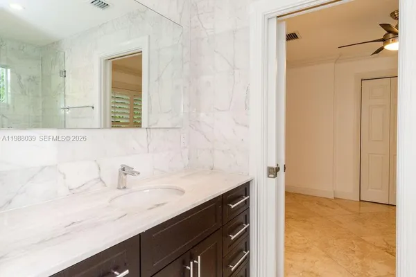 a bathroom with a shower and toilet