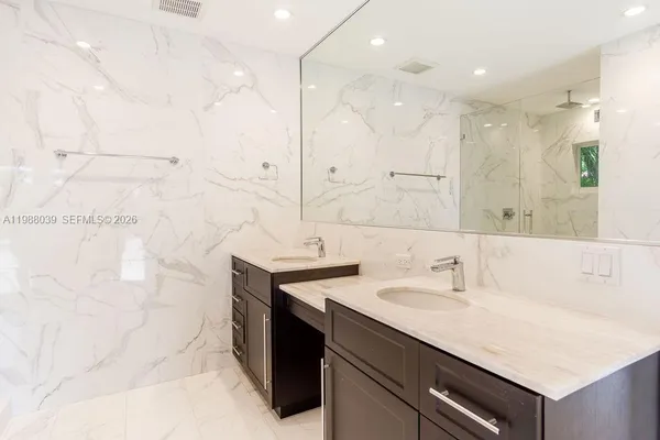 a white toilet sitting next to a shower curtain