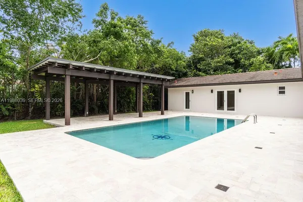 an aerial view of a house with a yard and plants