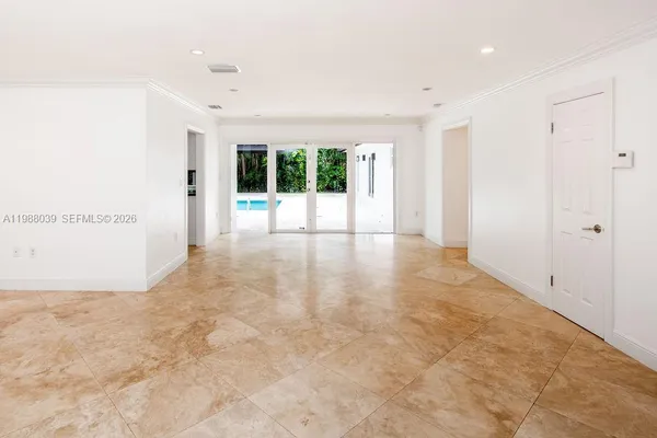 a view of a kitchen with a sink and a large window