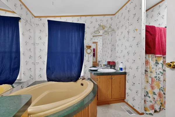 a bathroom with a bathtub and shower