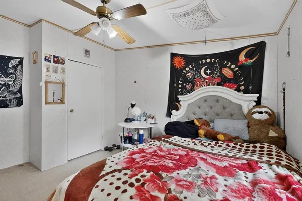 a bedroom with a bed and cabinets