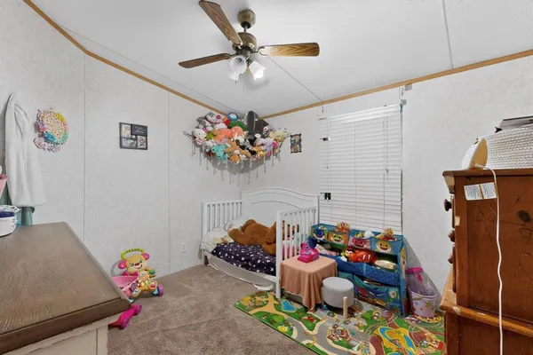 a bed room with furniture and a chandelier
