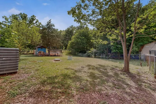 a view of a tree in a yard