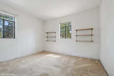 an empty room with windows