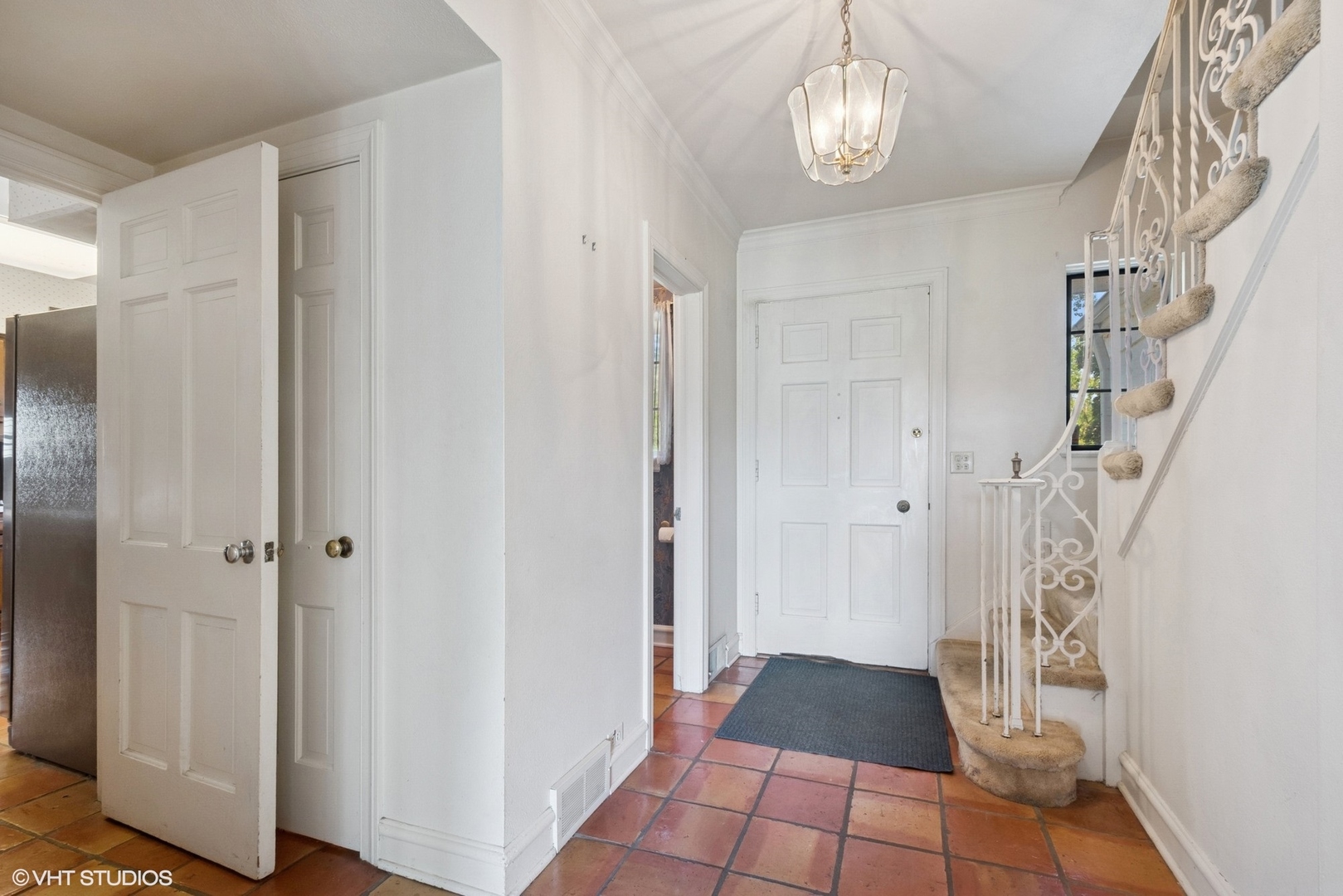 1288 Sunview Lane Winnetka, IL 60093 - Photo 2 of 25 a view of a hallway with wooden floor and staircase