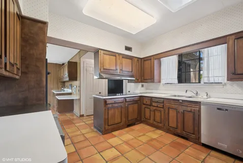 a kitchen with a sink and cabinets