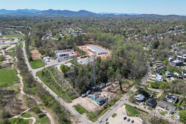 an aerial view of a house with a lake view