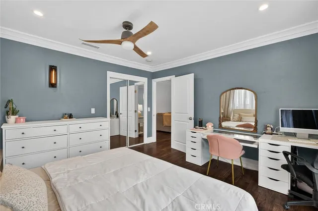 a bed room with a bed and a chandelier