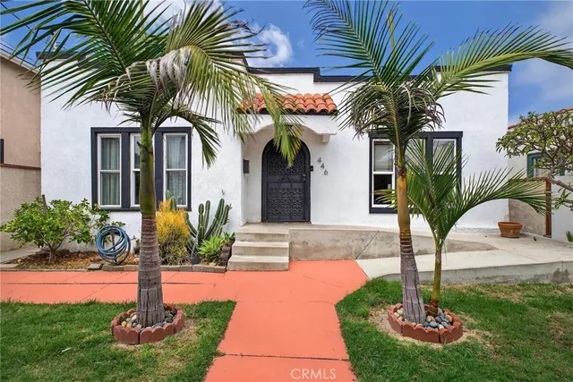 a front view of a house with garden