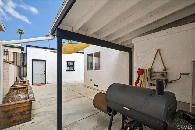 a view of a hallway with couches and a fireplace