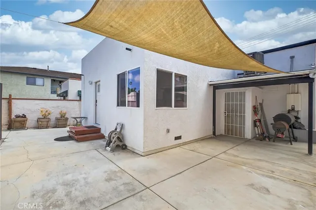 a bedroom with a bed and a chair