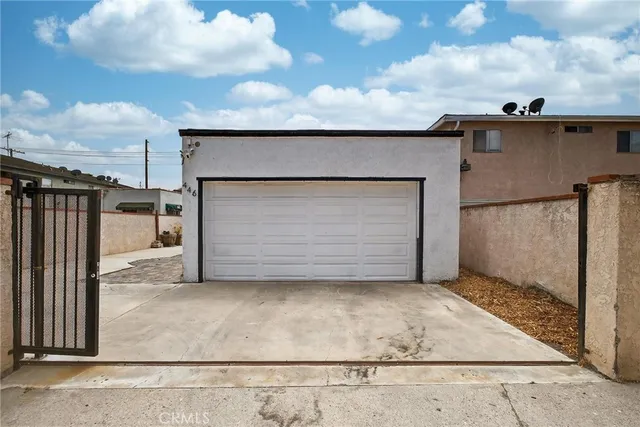 a room with a walk in closet and mirror