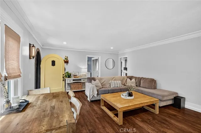 a living room with furniture and a table