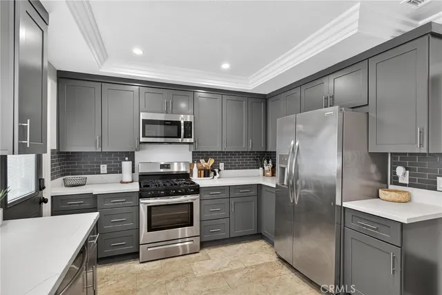 a kitchen with a refrigerator sink and microwave
