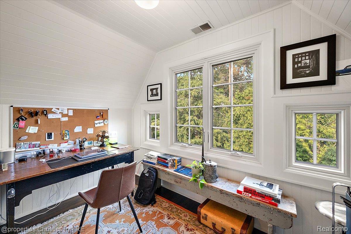 528 Covington Road Bloomfield Hills, MI 48301 - Photo 51 of 75 Attic room featuring multiple grid-pattern windows, white paneled walls, and a recessed ceiling light