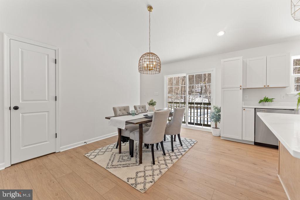 18289 Cameron Road Gordonsville, VA 22942 - Photo 17 of 71 a view of a dining room with furniture window and wooden floor