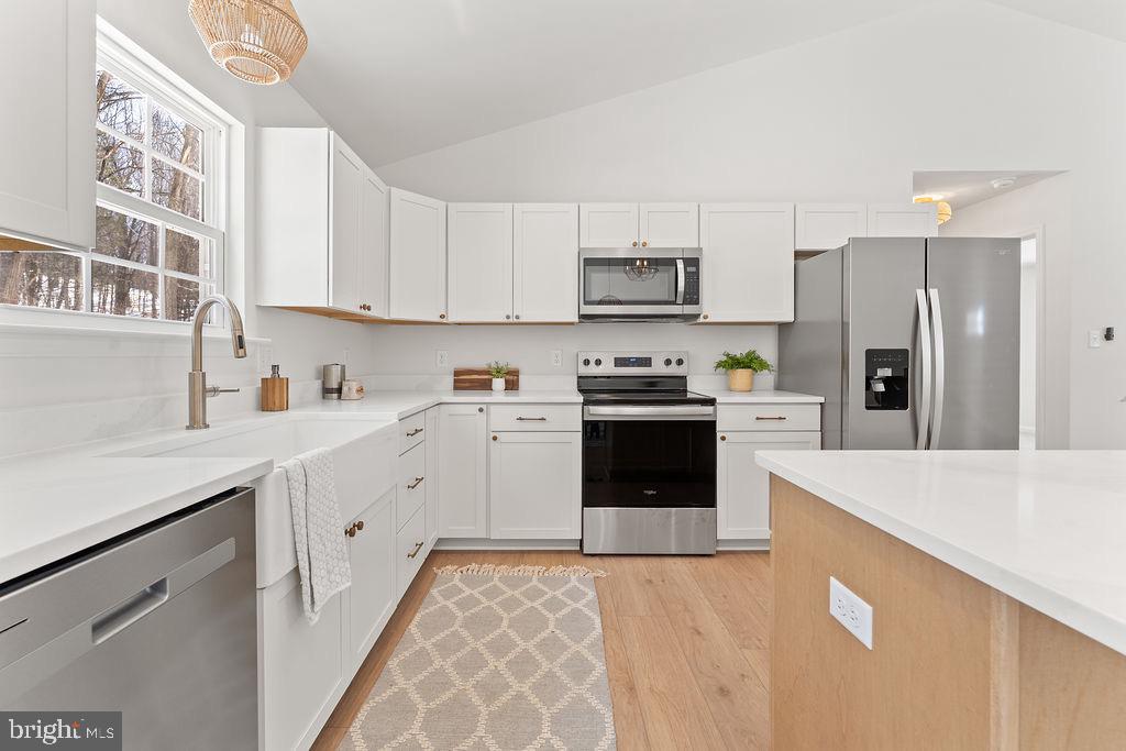 18289 Cameron Road Gordonsville, VA 22942 - Photo 20 of 71 a kitchen with stainless steel appliances granite countertop a refrigerator sink and stove