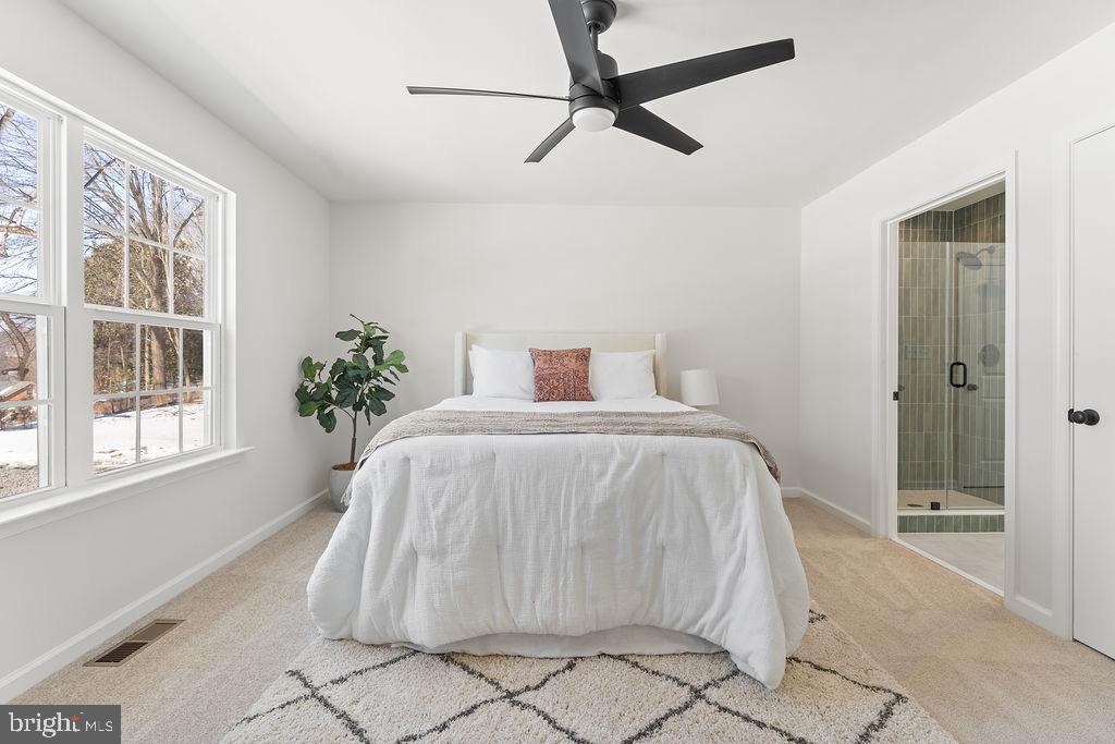 18289 Cameron Road Gordonsville, VA 22942 - Photo 24 of 71 a spacious bedroom with a bed and a window