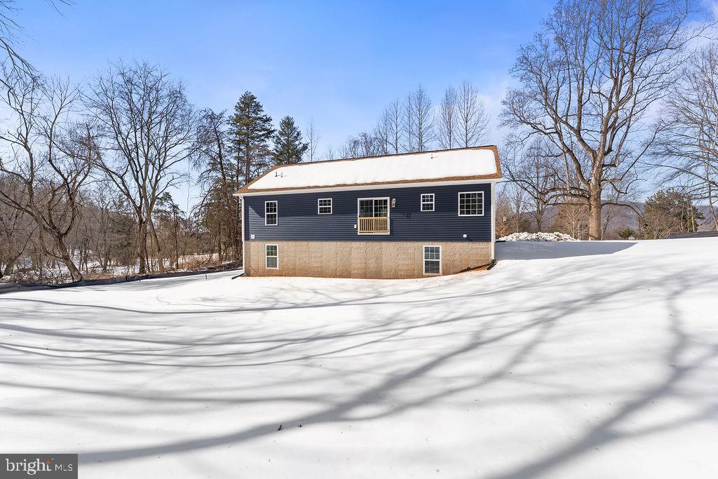 18289 Cameron Road Gordonsville, VA 22942 - Photo 68 of 71 a view of a house with a snow in the background