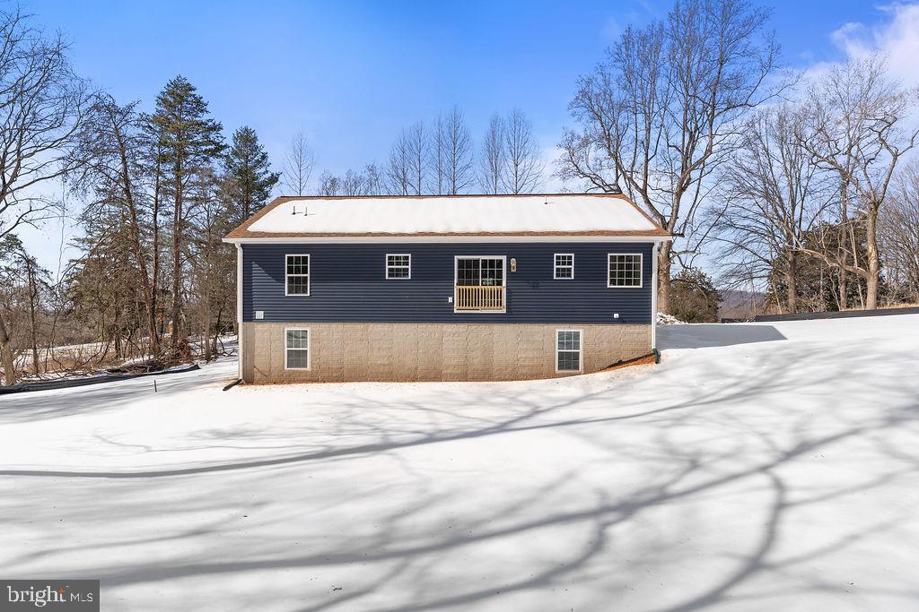 18289 Cameron Road Gordonsville, VA 22942 - Photo 69 of 71 a front view of a house with a yard and garage