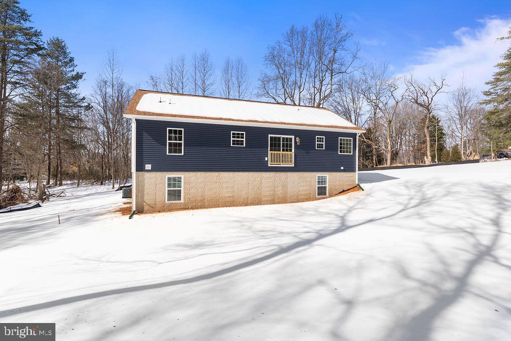 18289 Cameron Road Gordonsville, VA 22942 - Photo 70 of 71 a view of a house with snow on the road