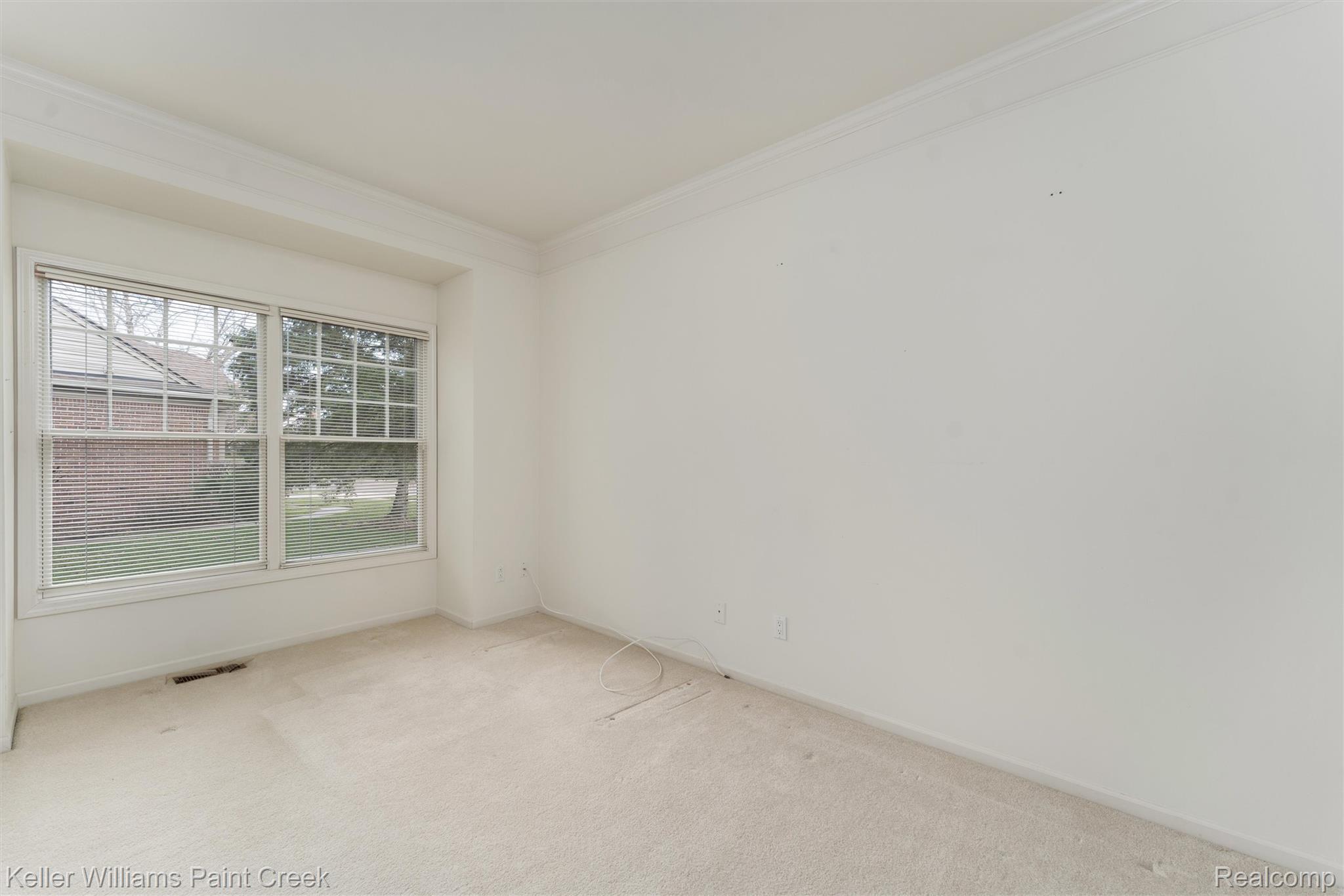 1685 Maple Creek Court Rochester, MI 48306 - Photo 24 of 49 Unfurnished room featuring light colored carpet and crown molding