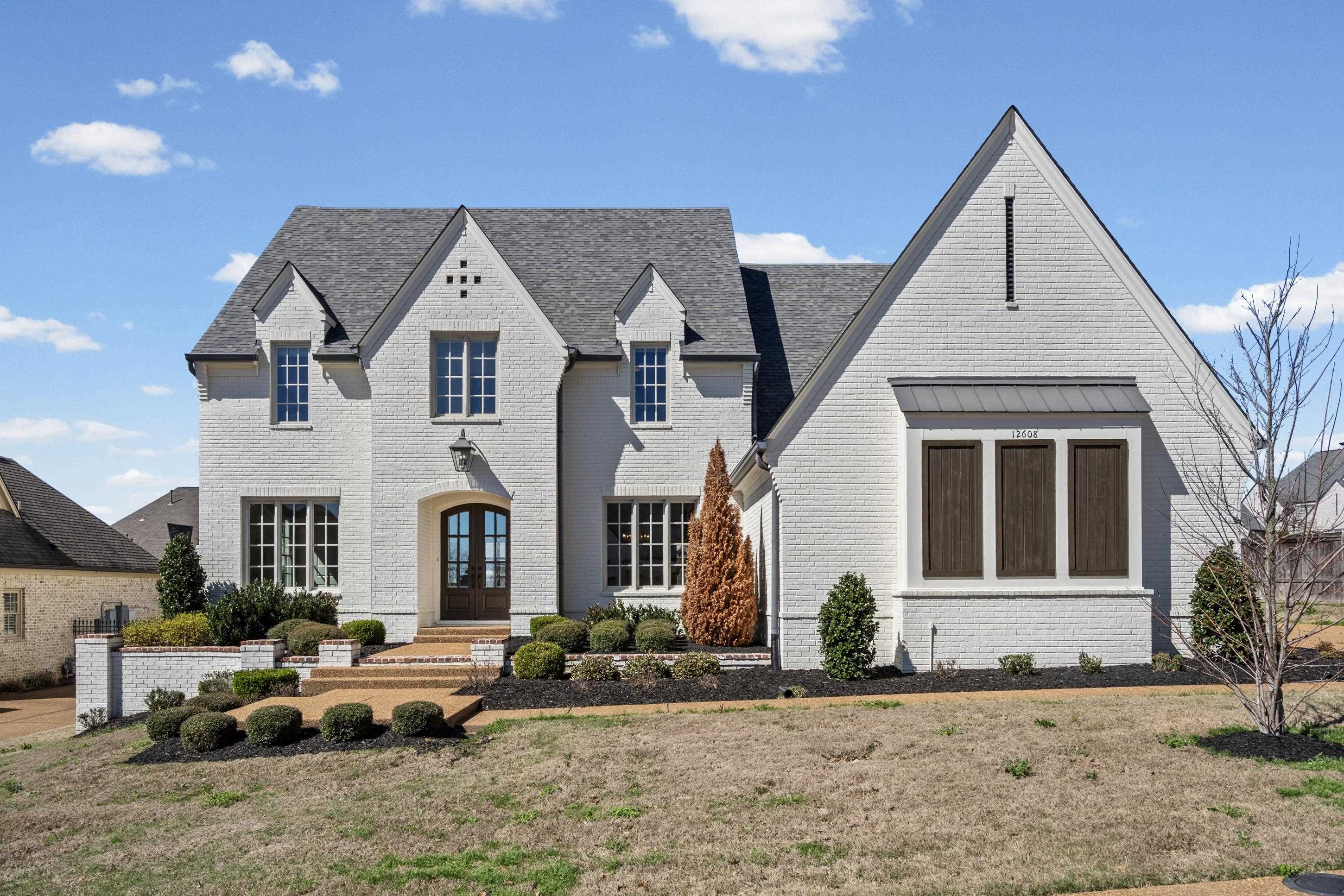 12608 Bravo Road Collierville, TN 38017 - Photo 2 of 40 a front view of a house with garden