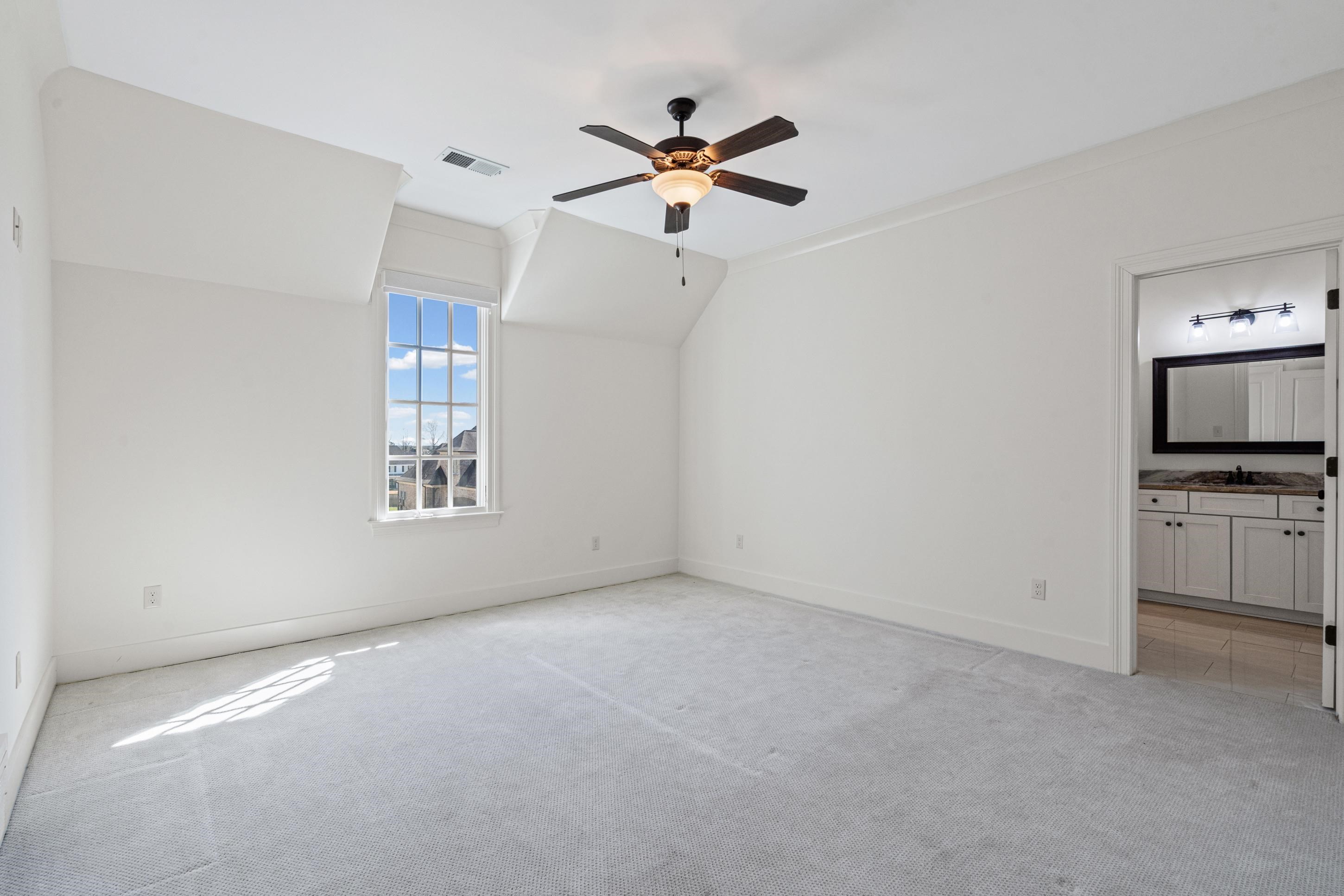 12608 Bravo Road Collierville, TN 38017 - Photo 20 of 40 wooden floor in an empty room with a window