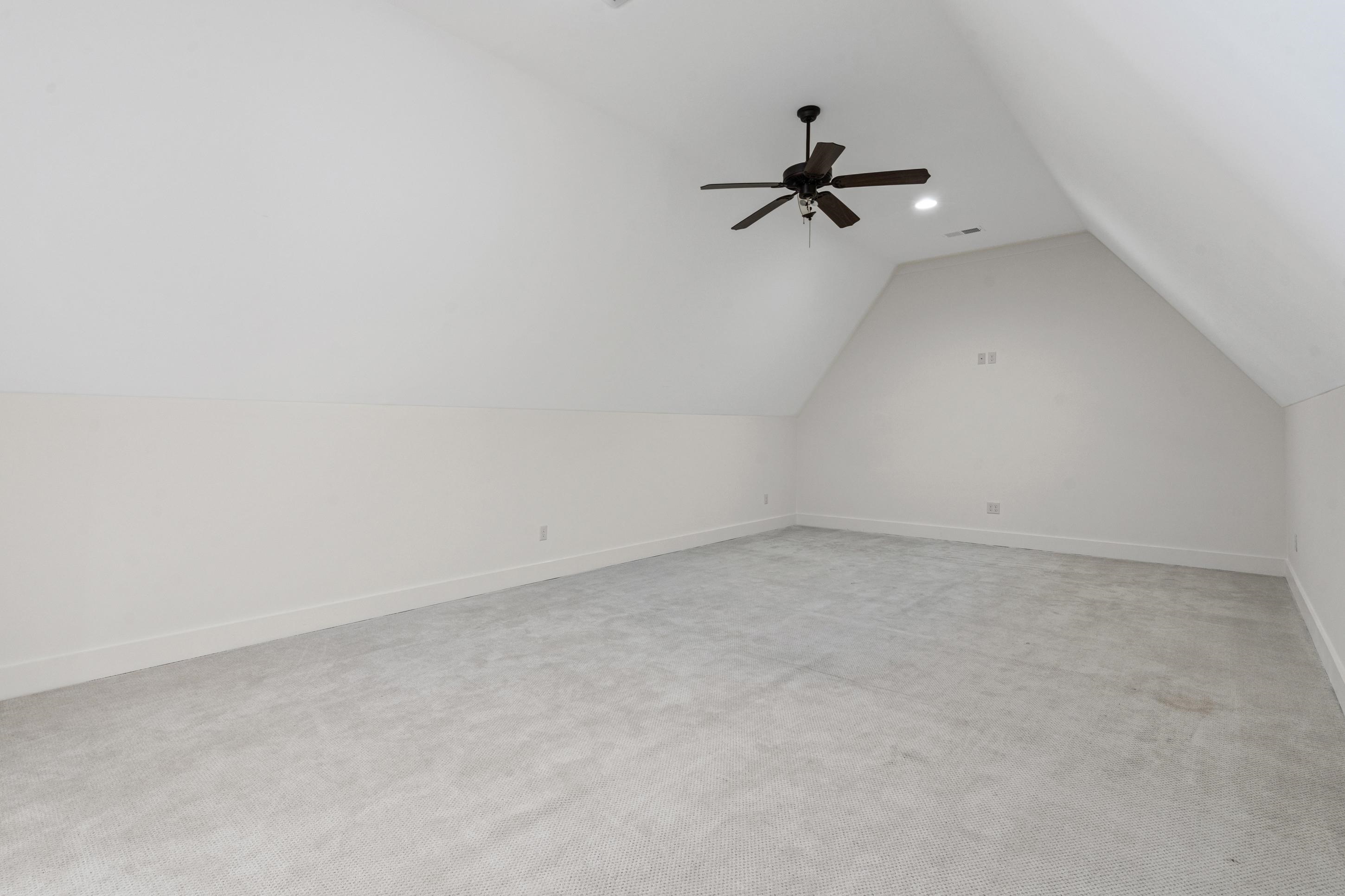 12608 Bravo Road Collierville, TN 38017 - Photo 21 of 40 Bonus room featuring light colored carpet, lofted ceiling, and a ceiling fan