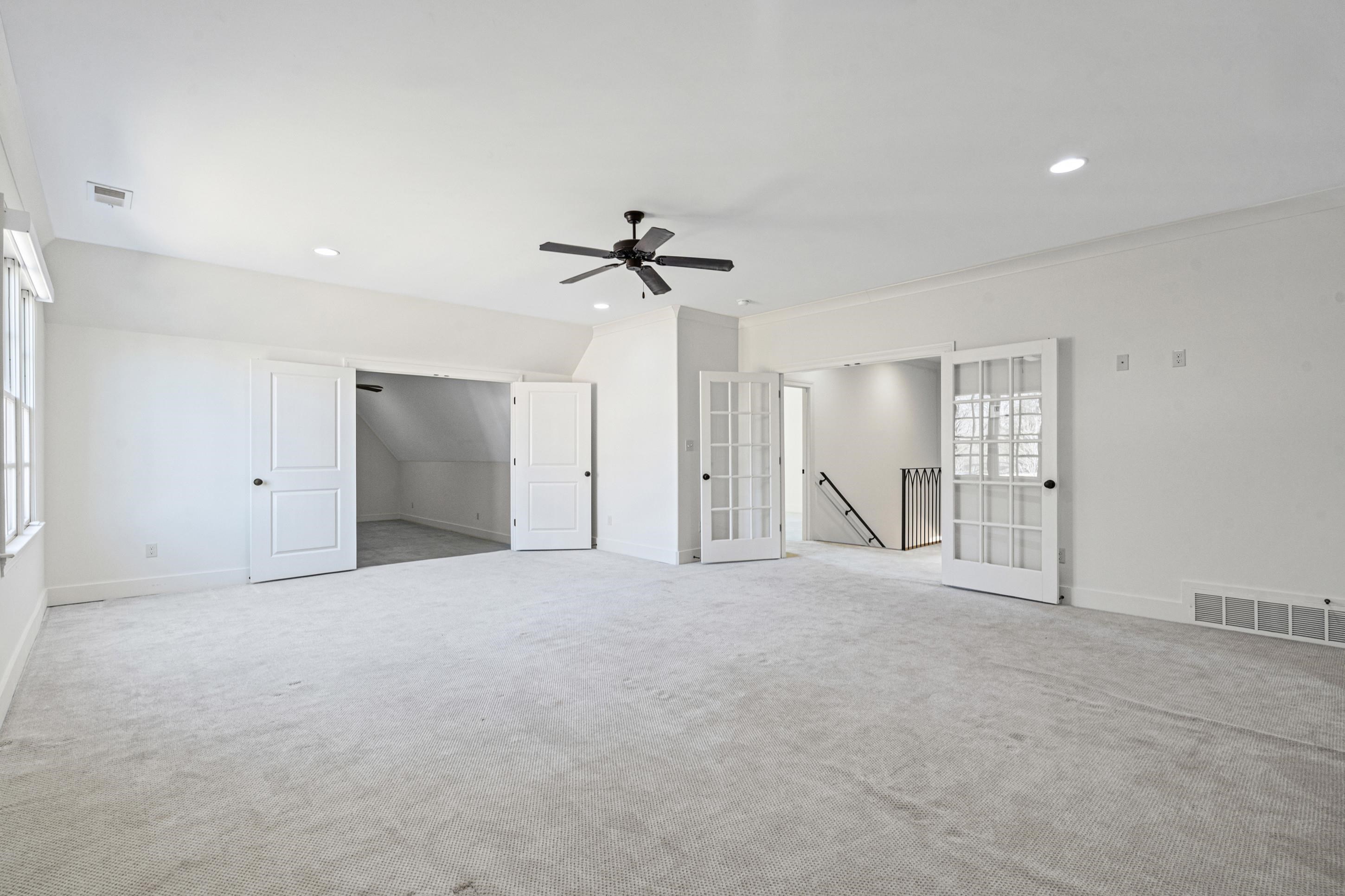12608 Bravo Road Collierville, TN 38017 - Photo 23 of 40 a view of an empty room with a ceiling fan
